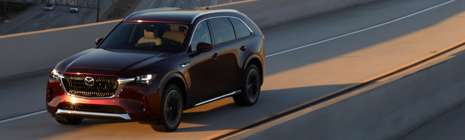 A fixed rate car loan could have you take the highway in your new Mazda CX 90.