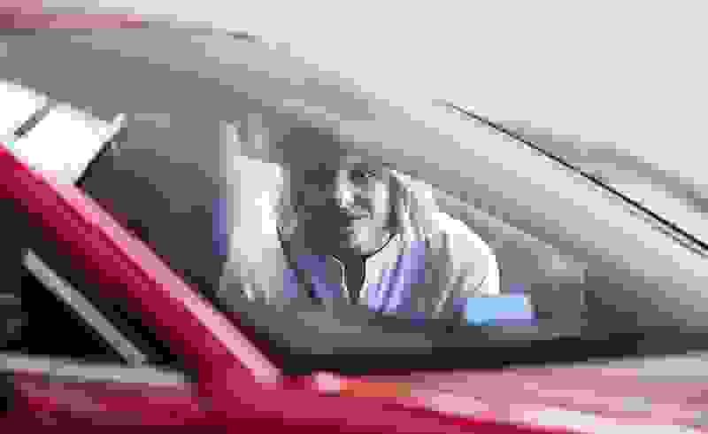Woman enjoying new Mazda with guaranteed future value.