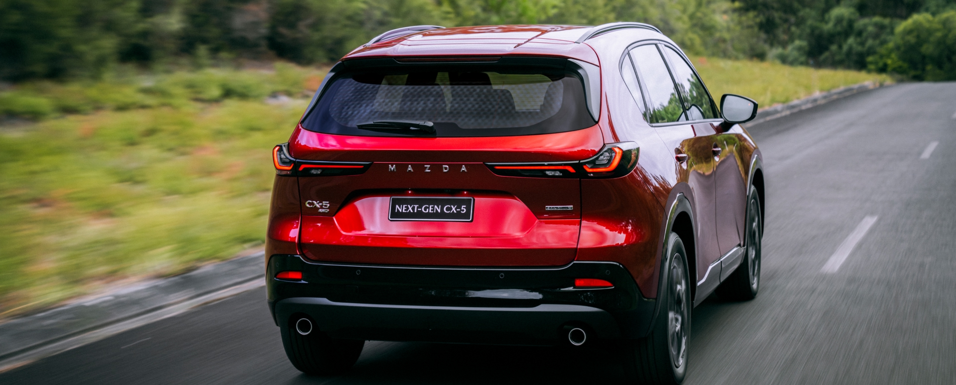 Rear of the Next-Gen Mazda CX-5 driving along the road