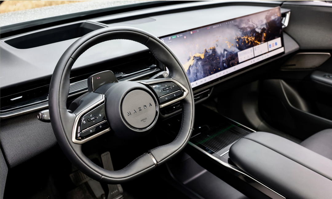 Interior of the All-Electric Mazda CX-6e SUV, showing new comfort cabin with large centre display.