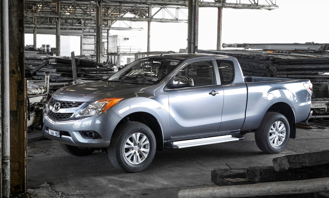 Silver second-generation Mazda BT-50 parked in a warehouse.