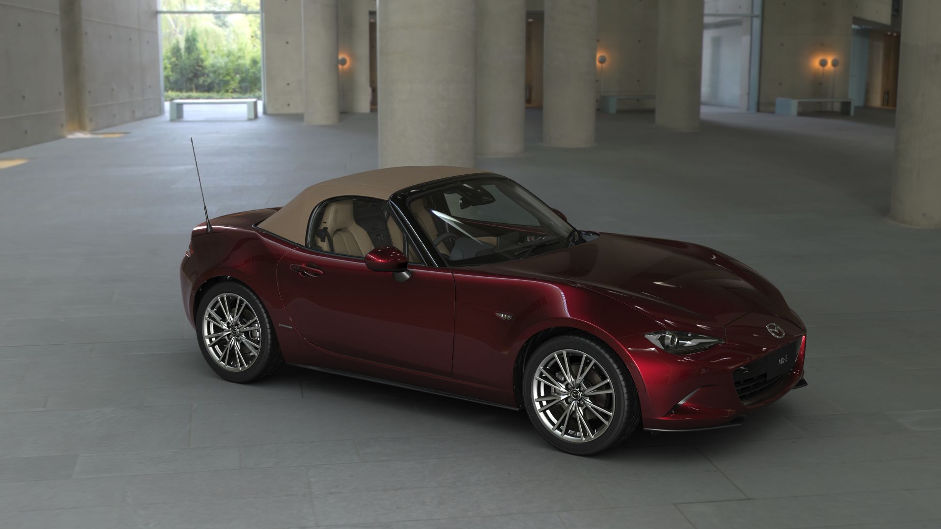 Mazda MX-5 35th Anniversary Edition showcased in Artisan Red Metallic—celebrating iconic roadster with exclusive design, sleek lines, and limited-edition styling.