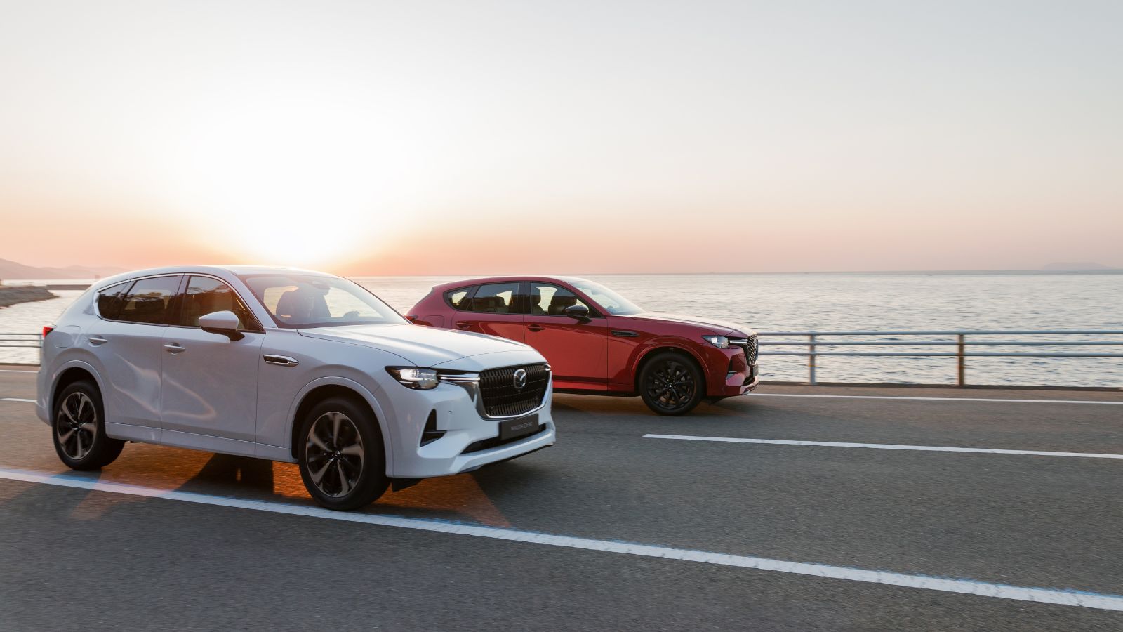 Mazda CX-60 Plug in hybrid car s in white and red exterior colours