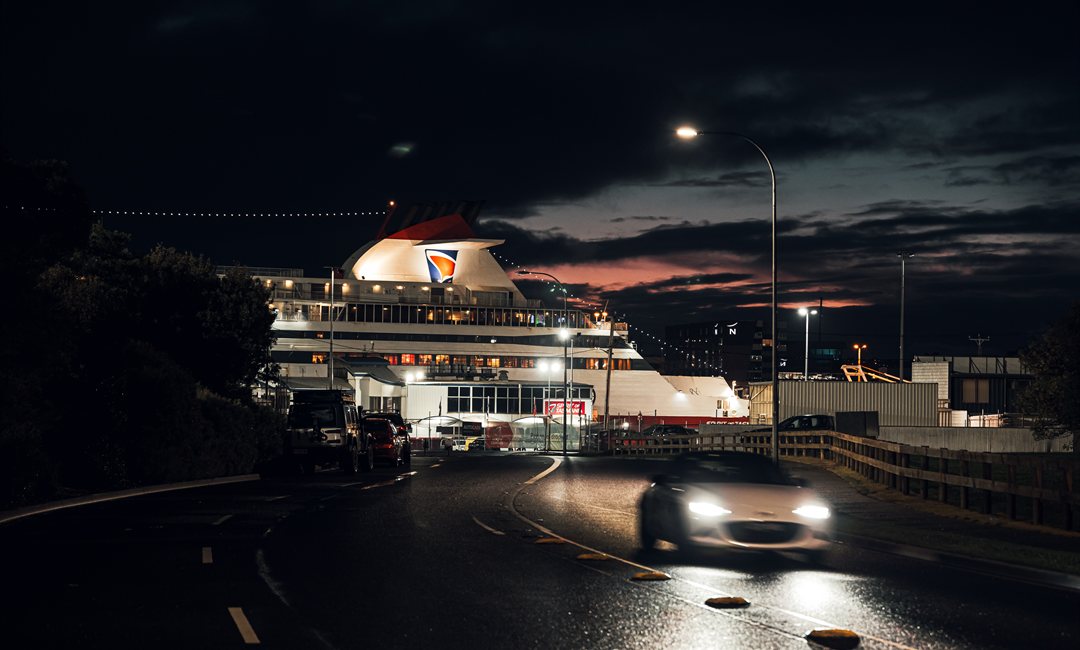  Mazda MX-5 driving on a wet Devonport road at dusk towards the docked Spirit of Tasmania ferry.